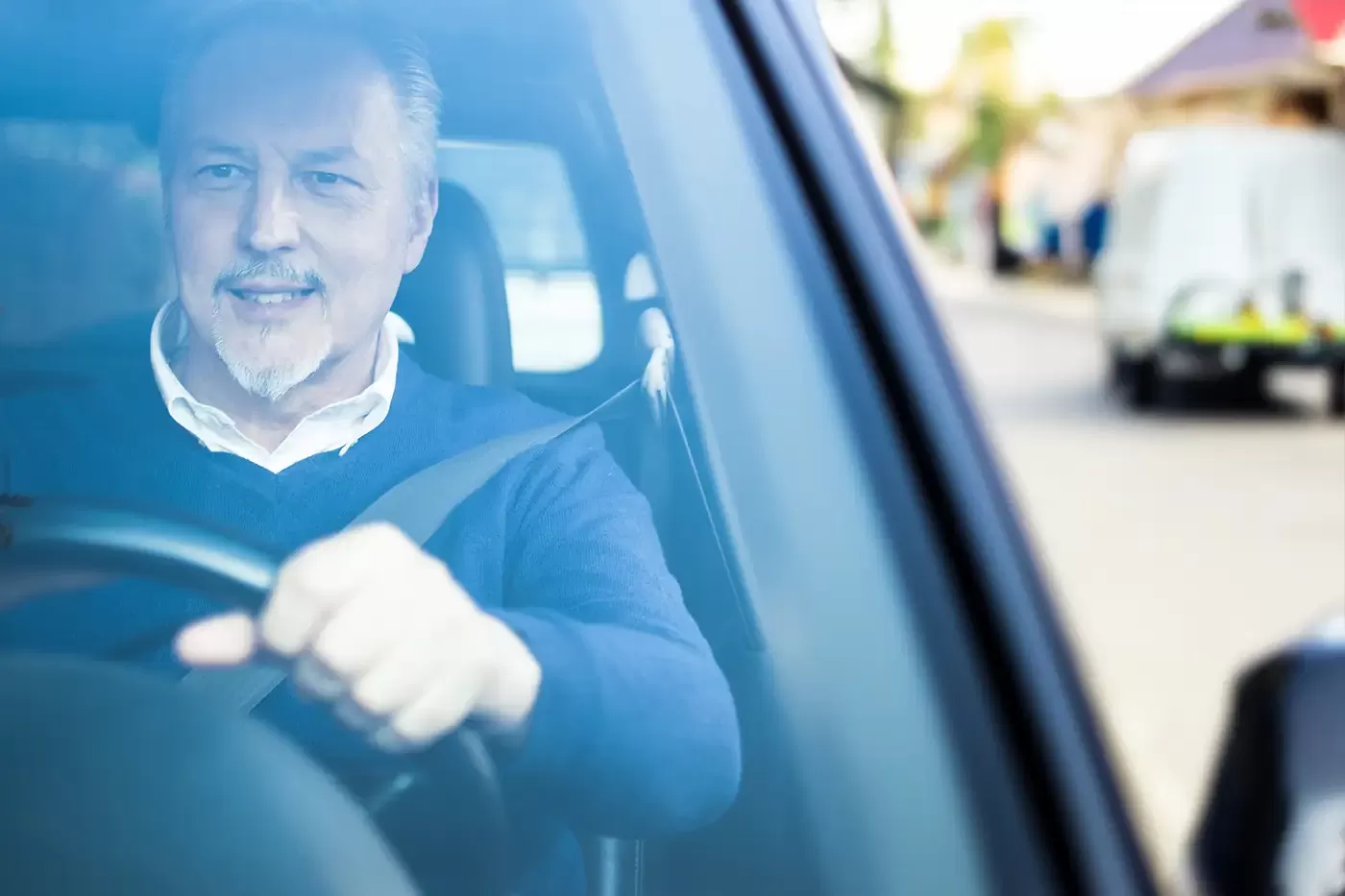 Photo of a driver for behavioral health transport in a SUV on the streets of Grand Junction, Colorado